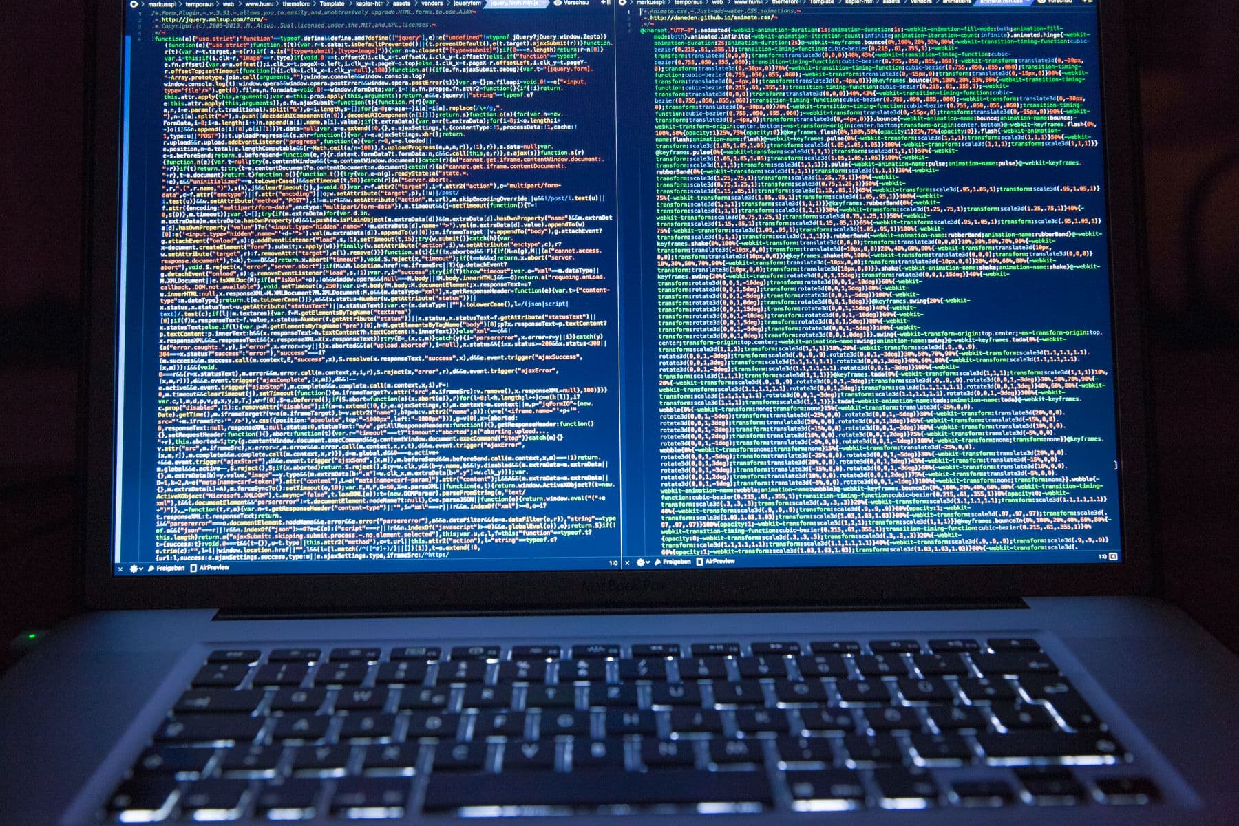 Laptop showing code on a dark screen