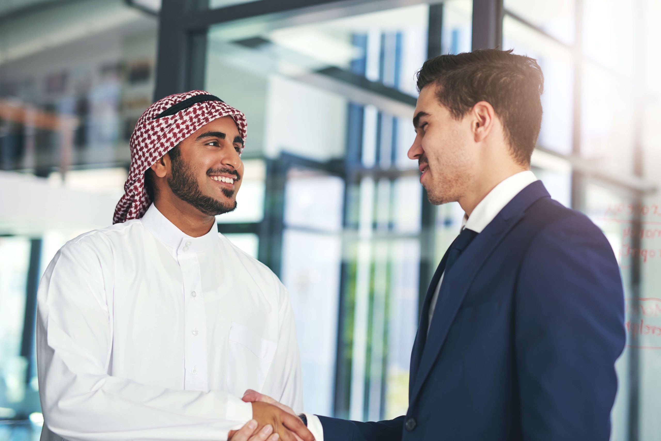 shot of a young muslim businessman shaking hands w 2025 04 06 11 32 59 utc 1 scaled